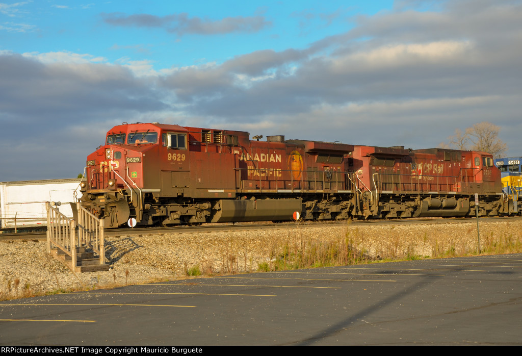 CP AC44CW Locomotives leading a train